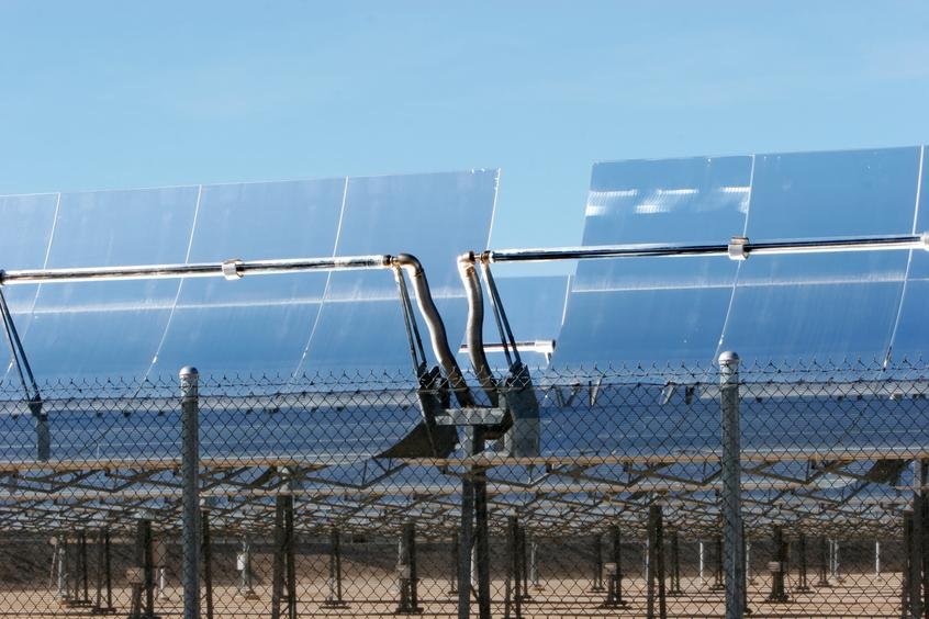 Rows of solar panels under a clear sky