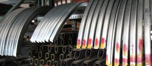 Coils of garage door springs on a warehouse rack